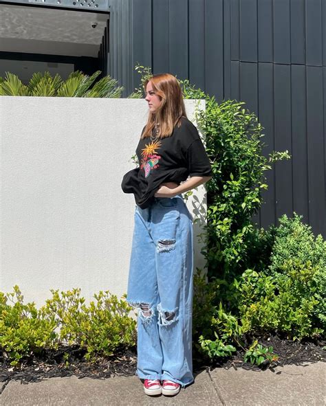 oversized shirt with baggy jeans.